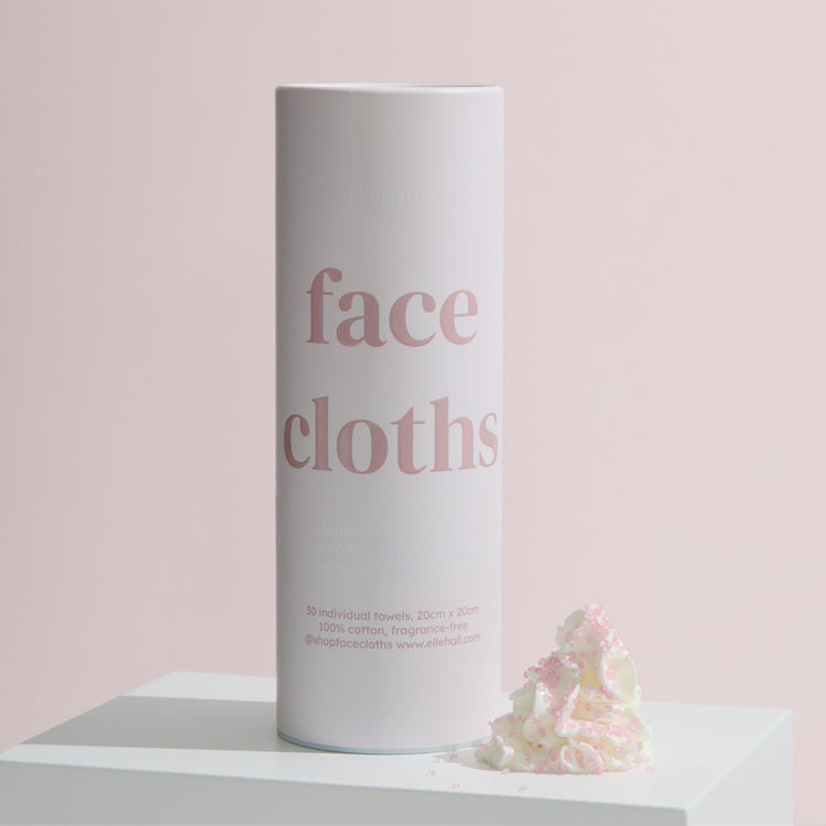 lifestyle 2 box, a tube of face cloths on a plinth with petals